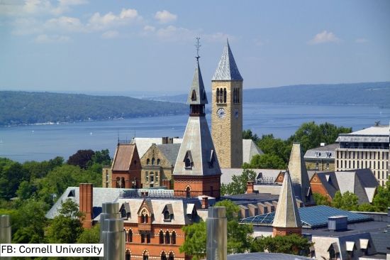 Cornell's campus in front of a blue Cayuga Lake.
